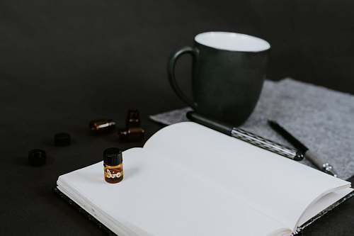 coffee cup white page of book grey